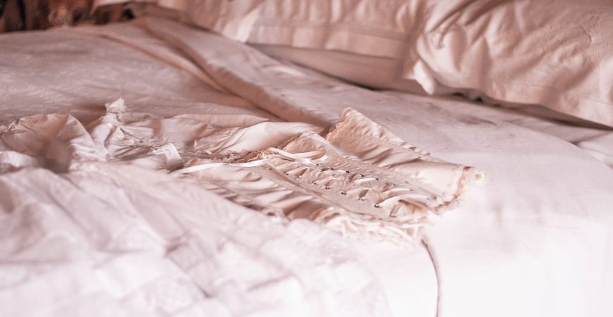 White Corset on Bed