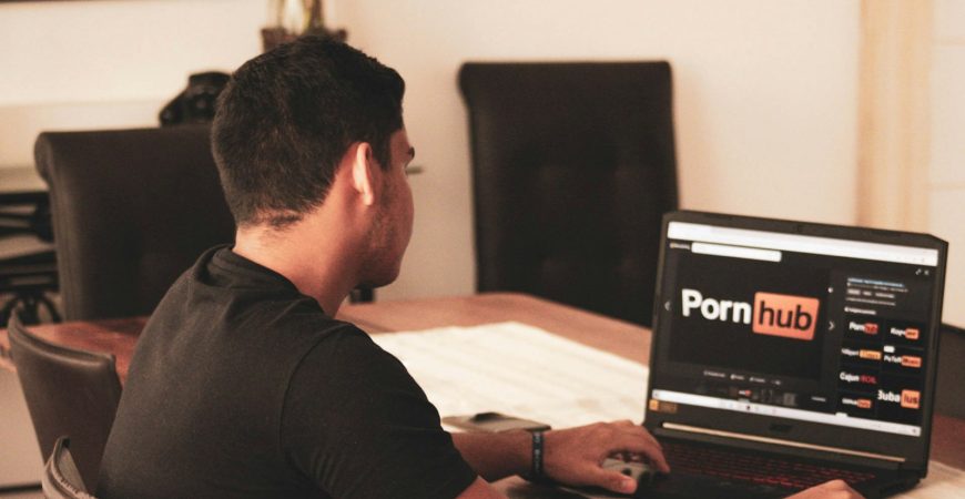 man in black t-shirt using black laptop computer